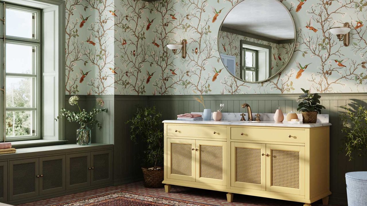 green bathroom with bird patterned wallpaper and green wall panelling and yellow vanity to ask can you wallpaper a bathroom