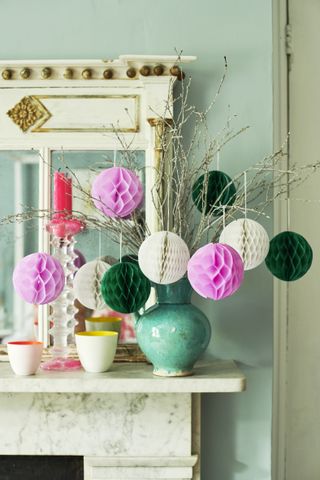 Branches in vase with spherical honeycomb paper decorations