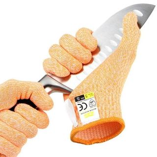 A pair of orange gloves holding a large kitchen knife