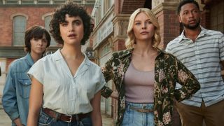 Elsie Fisher, Sarah Yarkin, Nell Hudson, and Jacob Latimore lined up on a deserted street in Texas Chainsaw Massacre.