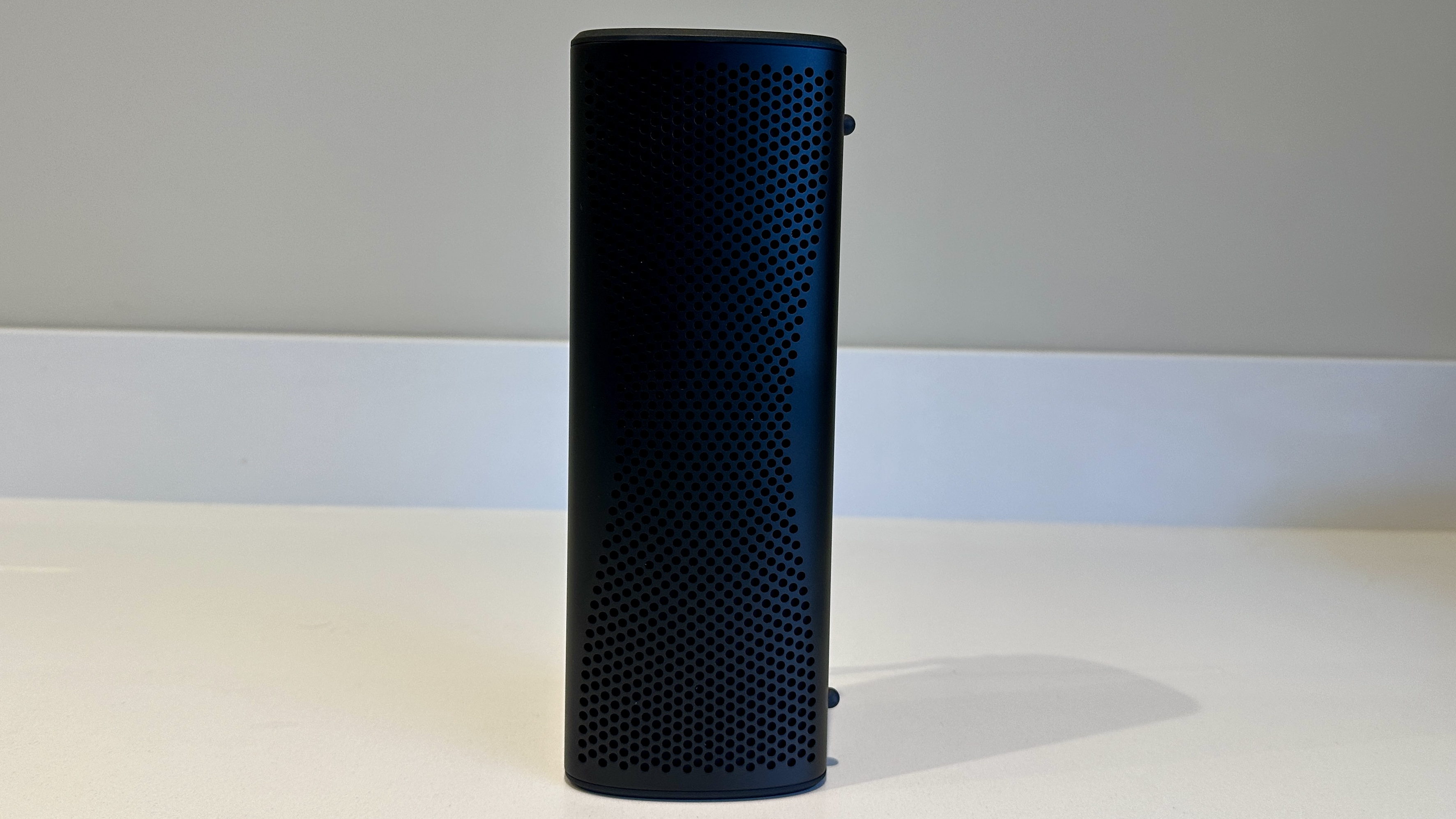 KEF Muo 2025 in black, on a white table