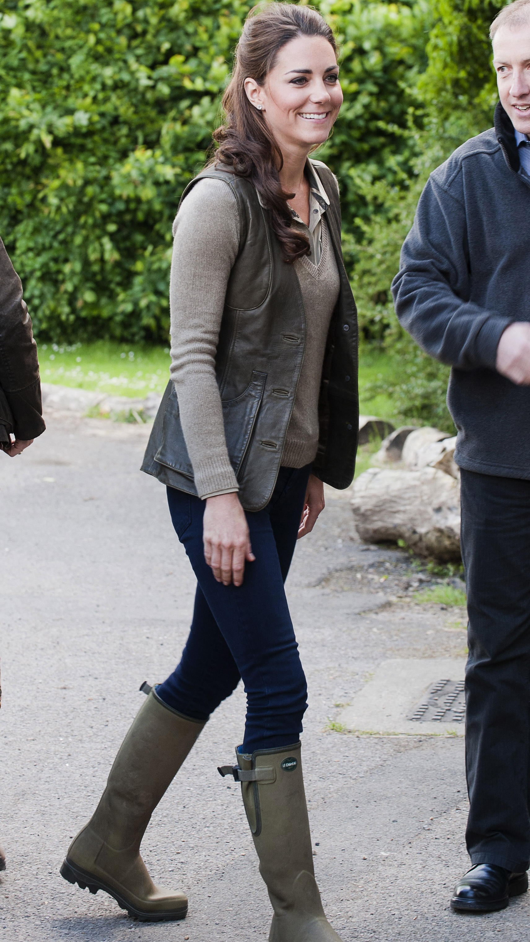 Catherine, Princess of Wales, wearing wellies, smiles as she visits an 'Expanding Horizons' Primary School camp