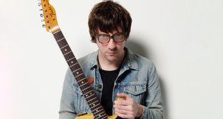 A portrait of Blur guitarist Graham Coxon with his Telecaster.