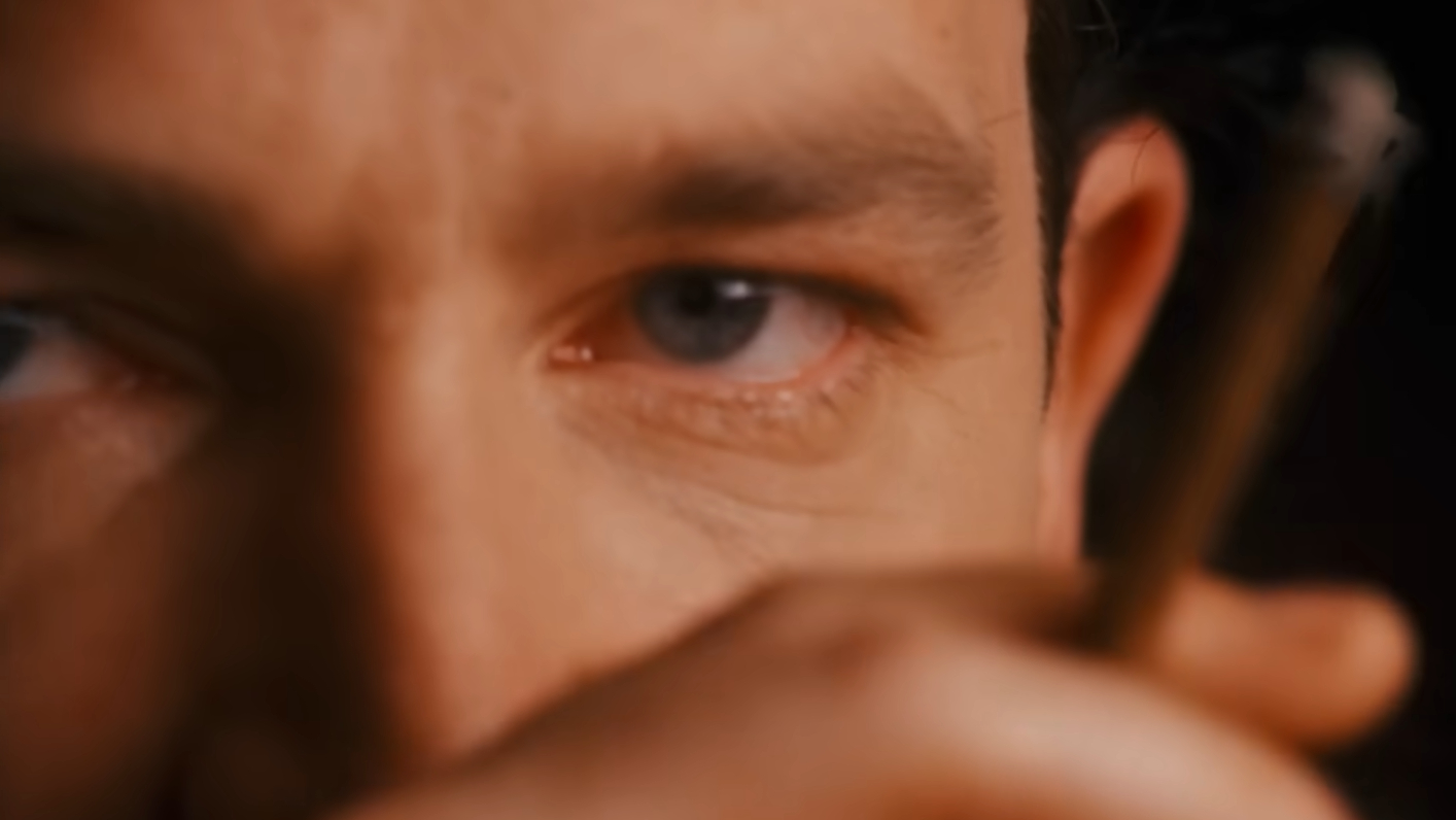 Close up of Bono with a cigar