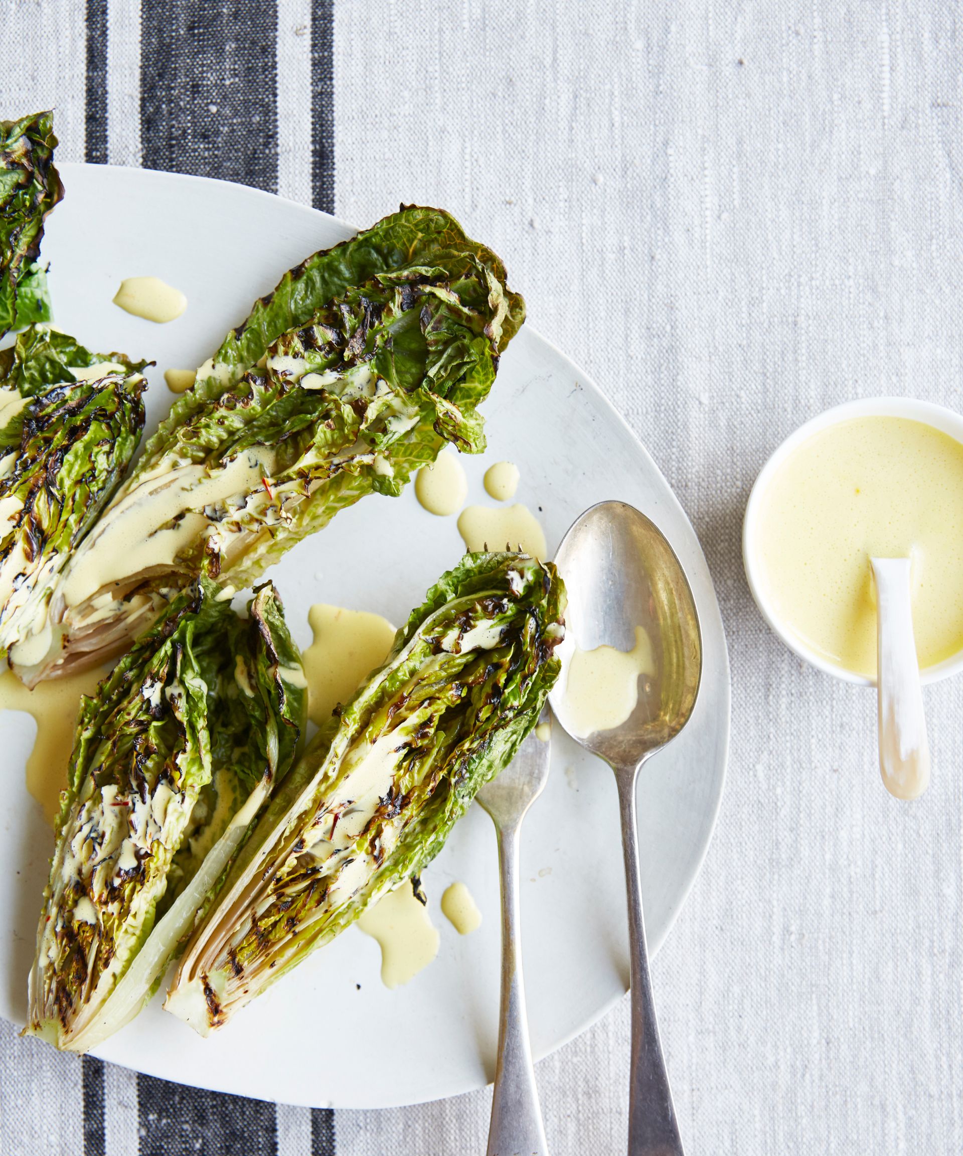 Overhead shot of charred little gem with saffron dressing recipe