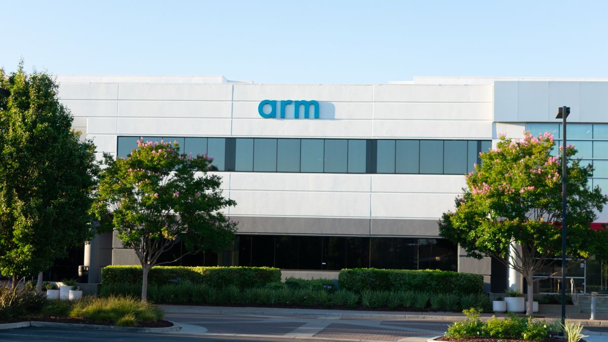 Modern building surrounded by trees with Arm&amp;#039;s logo displayed on the facade