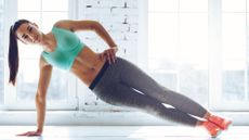 woman doing side plank exercise 