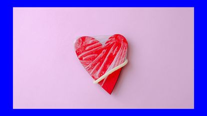 image of condom on a red heart shaped object