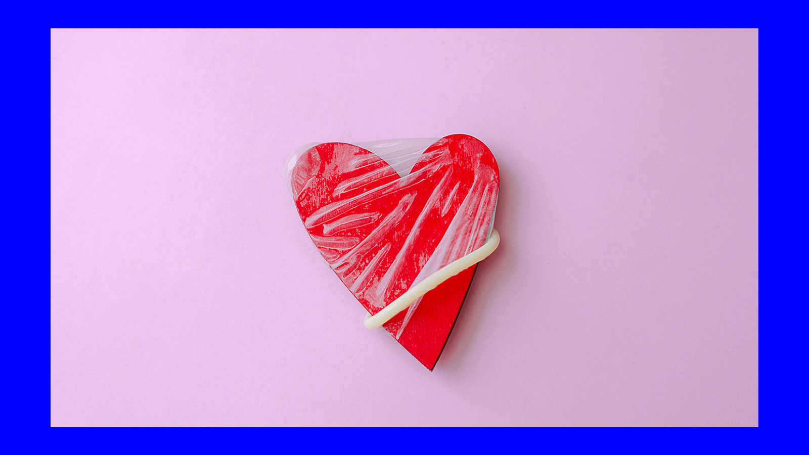 image of condom on a red heart shaped object