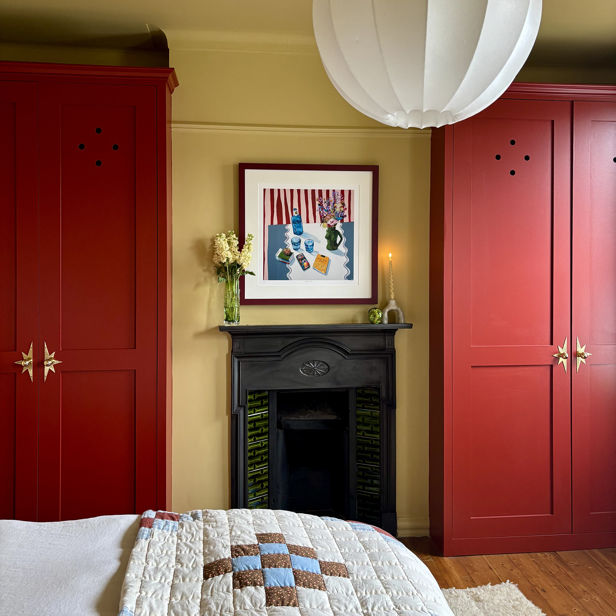 bedroom with red cupboards
