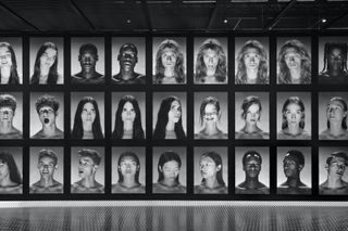 Wall of photographs of twins, part of Gucci S/S 2023 show set
