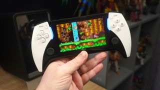 Hand holding Project X PlayStation Portal handheld clone 