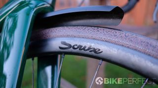 Close up of Scribe Gravel Wide++ rim fitted to a road bike