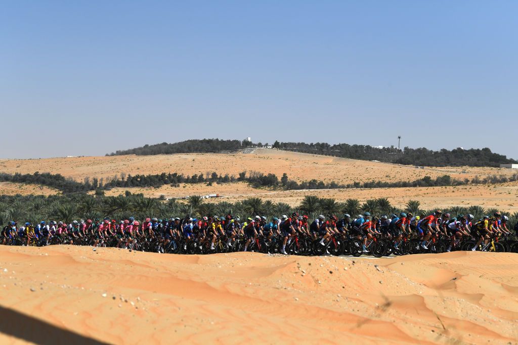 MADINAT ZAYED UNITED ARAB EMIRATES FEBRUARY 20 A general view of the Peloton passing through the desert during the 4th UAE Tour 2022 Stage 1 a 184km stage from Madinat Zayed to Madinat Zayed UAETour WorldTour on February 20 2022 in Madinat Zayed United Arab Emirates Photo by Tim de WaeleGetty Images