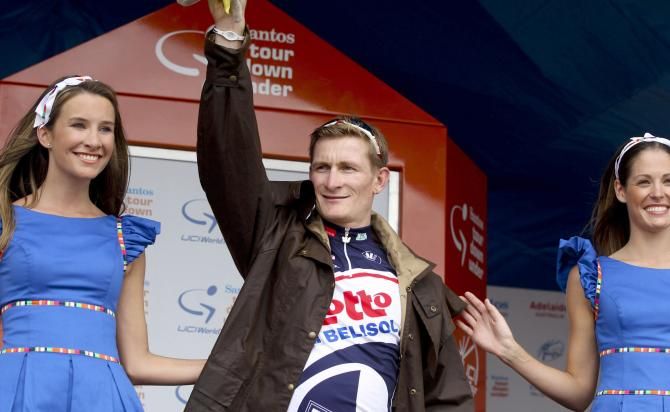 Andr&eacute; Greipel dons a few extra layers on the podium