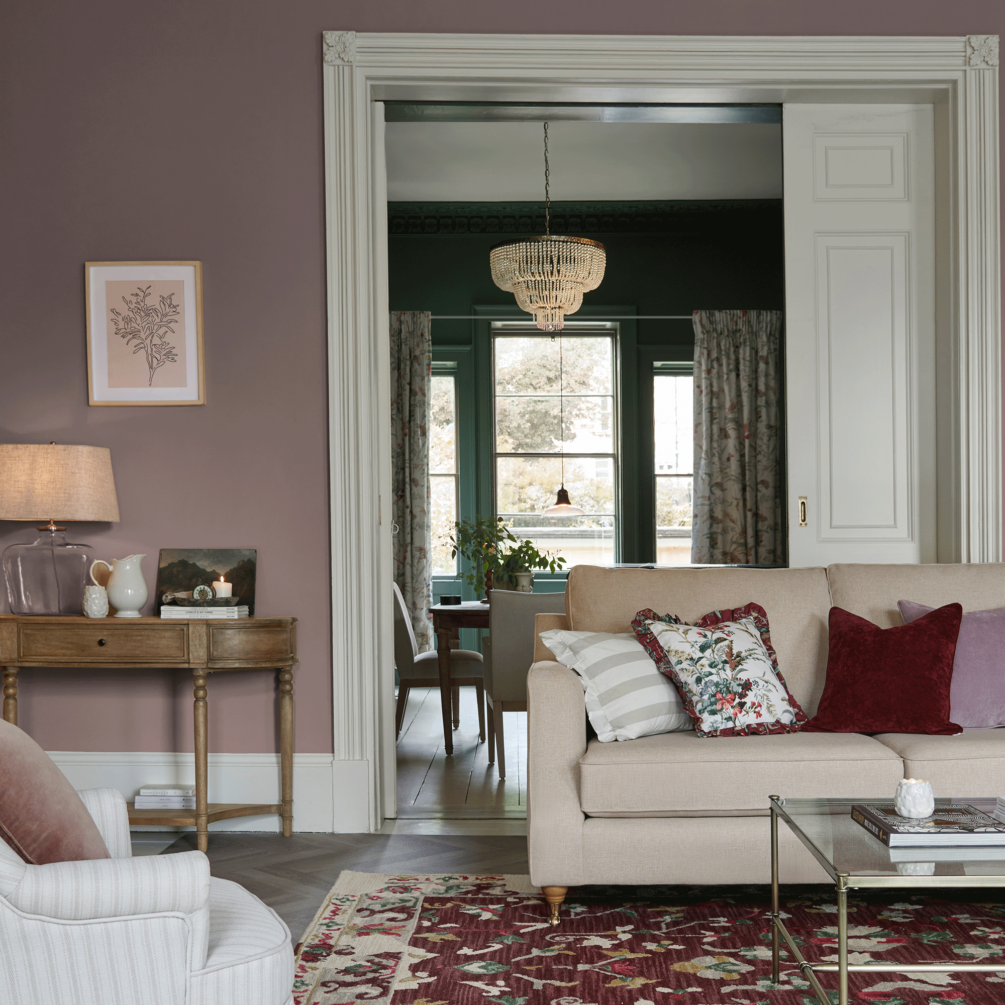 Purple living room with chandelier and beige sofa