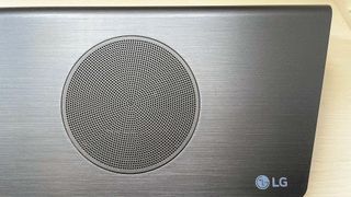 LG S95QR soundbar showing closeup of speakers with LG logo at bottom right corner