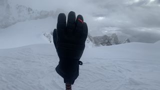 The North Face Summit Series Patrol Gore-Tex Gloves on a ski pole in the snowy Alps