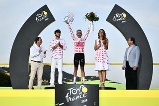 Richard Carapaz on the 11th Tour de France podium as he wins the polka dot jersey.