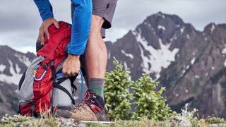 best daypacks: hiker with daypack