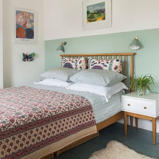 bedroom with half painted green wall