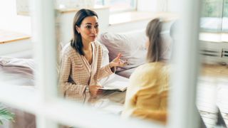 Woman talking to therapist in office