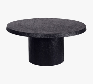 black round/cylindrical coffee table with textured top