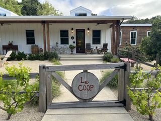 The wooden gate leading to the Le Coop house at Farm Blanc et Rouge in Paso Robles, California