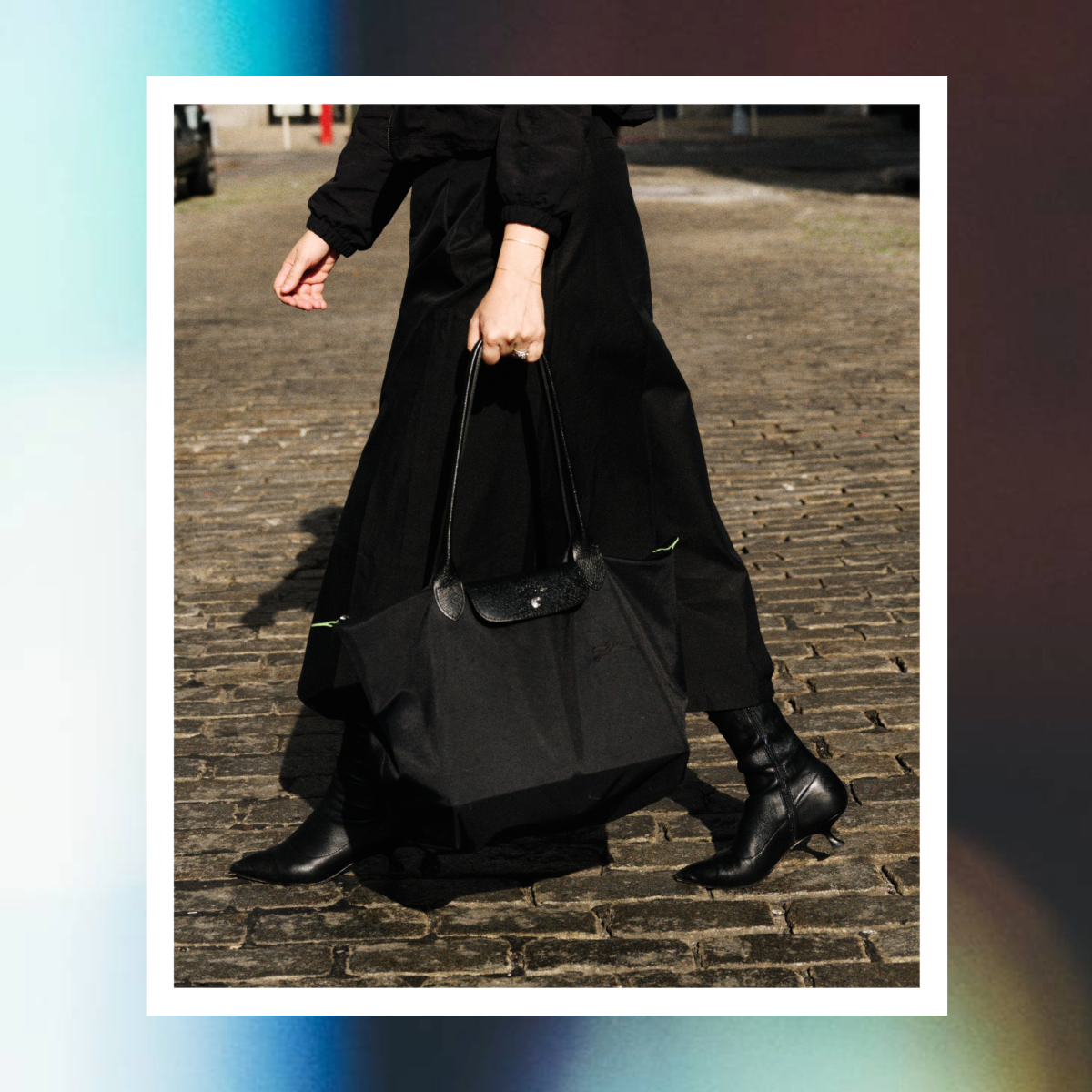 Julia Marzovilla carrying a black longchamp le pliage 