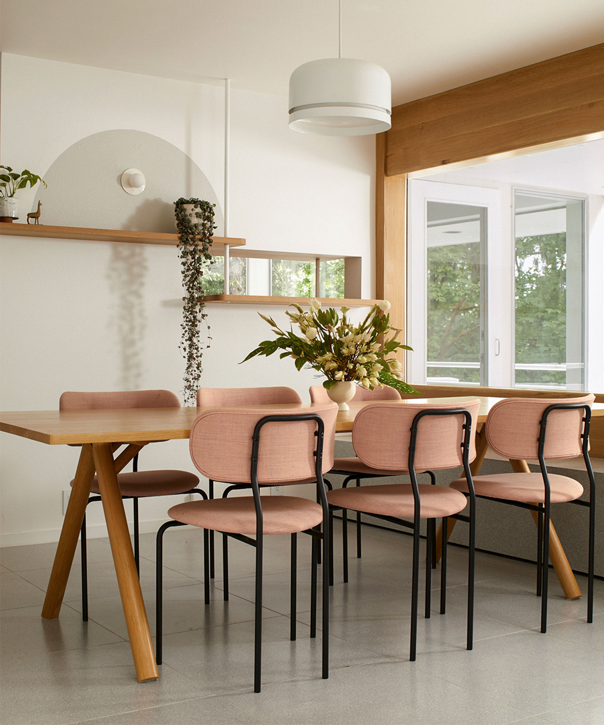 dining room wall ideas with table and pink chairs