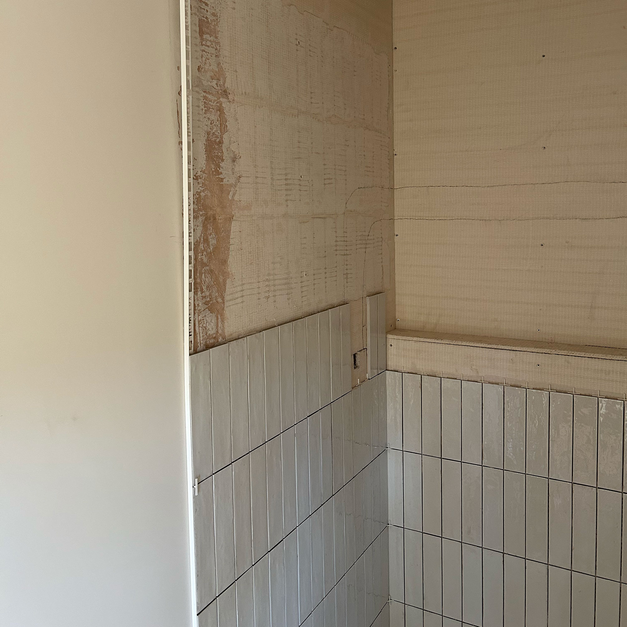 Bathroom mid being tiles