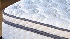 A Close up on the corner of a new mattress