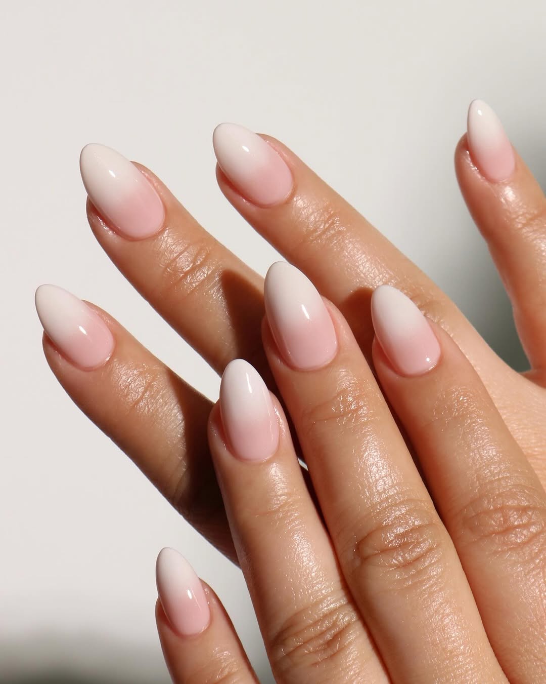 cherry blossom nails featuring white and pink polishes