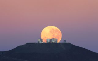 The moon sets on Cerro Paranal, home of ESO's Very Large Telescope (VLT), in Chile.