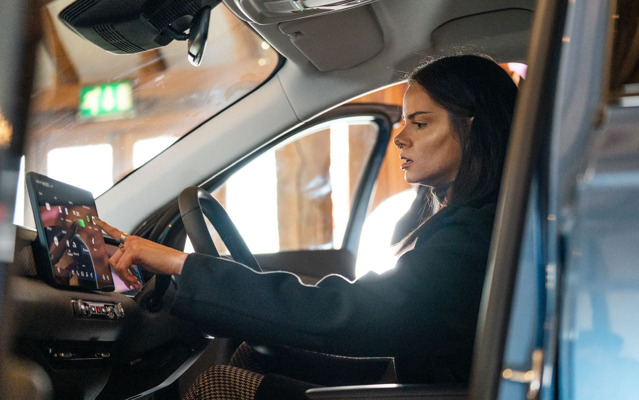 The journalist frankie youd sat in a car, prodding the infotainment system