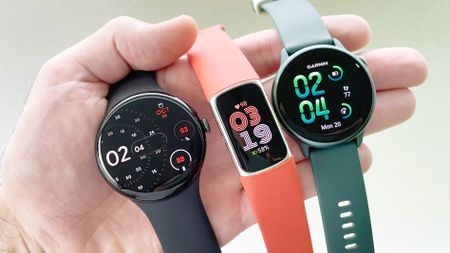 Close-up of the Pixel Watch 4, Fitbit Charge 6 and Gamin Vivoactive 6