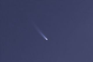 a white fuzzy streak on a dark blue background