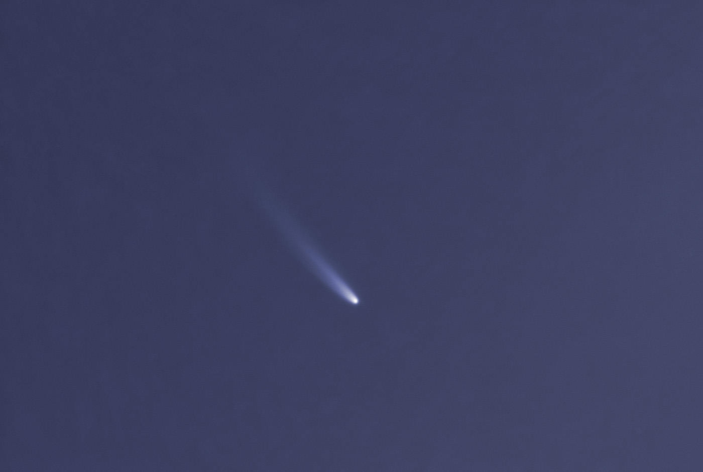 a white fuzzy streak on a dark blue background