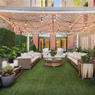 balcony with decorating lamps and sofa set with white cushions