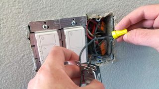 Installing a HomeKit-enabled Lutron Caseta wireless light switch.
