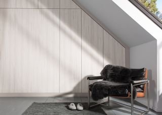 Bespoke built in wardrobes are angled to sit perfectly beneath a sloped ceiling