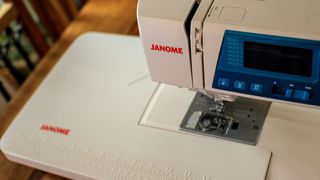 A photo of a sewing machine's extension tray from above