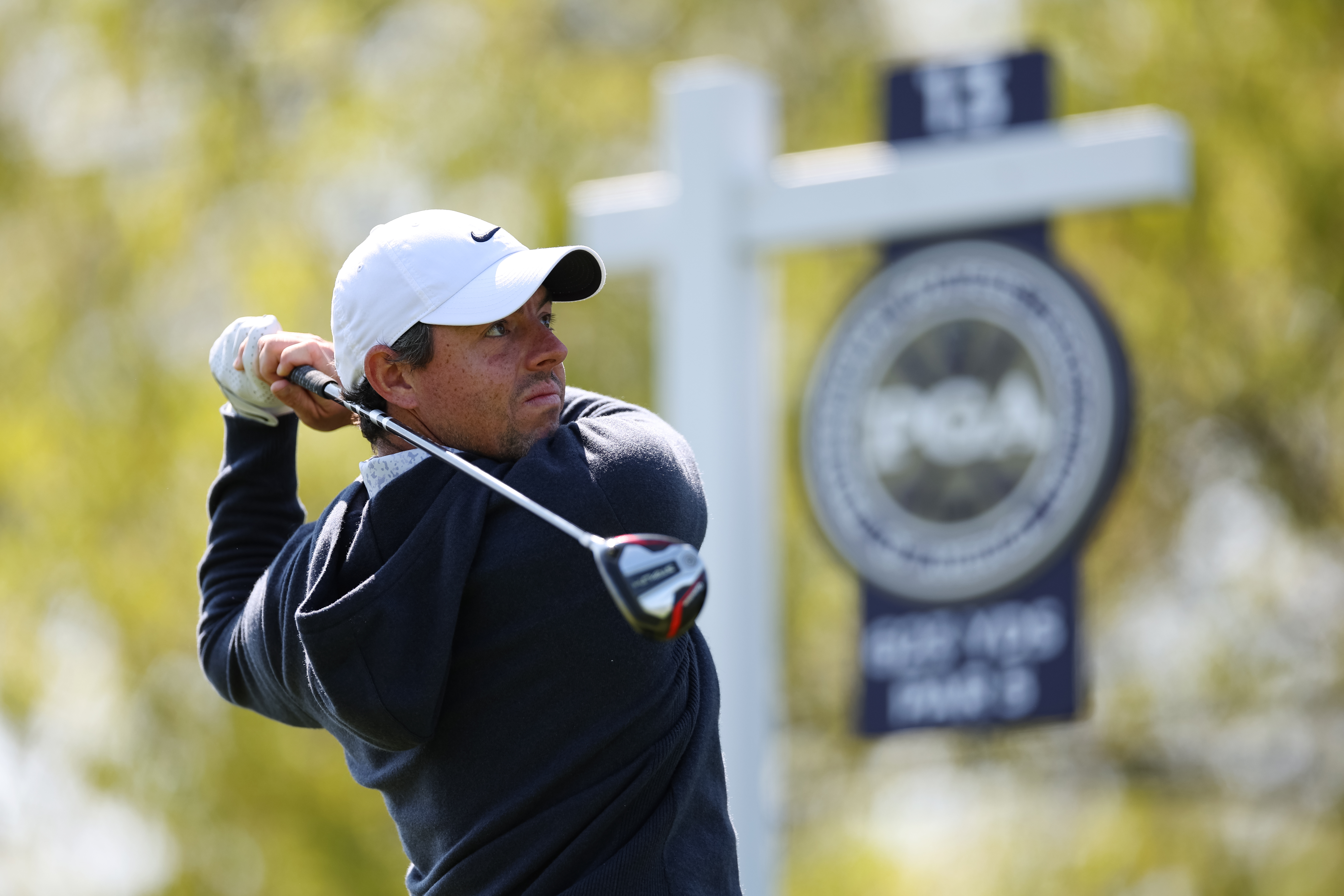 Rory McIlroy holds his finish on a fairway wood shot