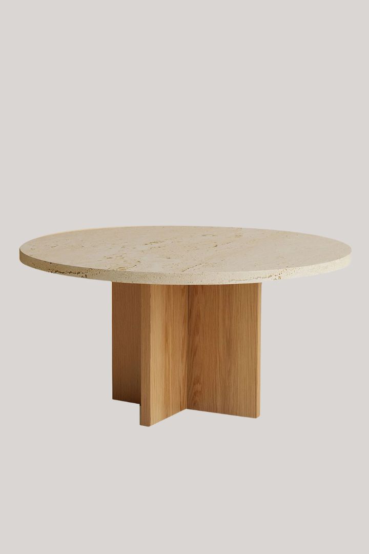 Tinian Roman Travertino and Durmast Coffee Table against pale beige background.
