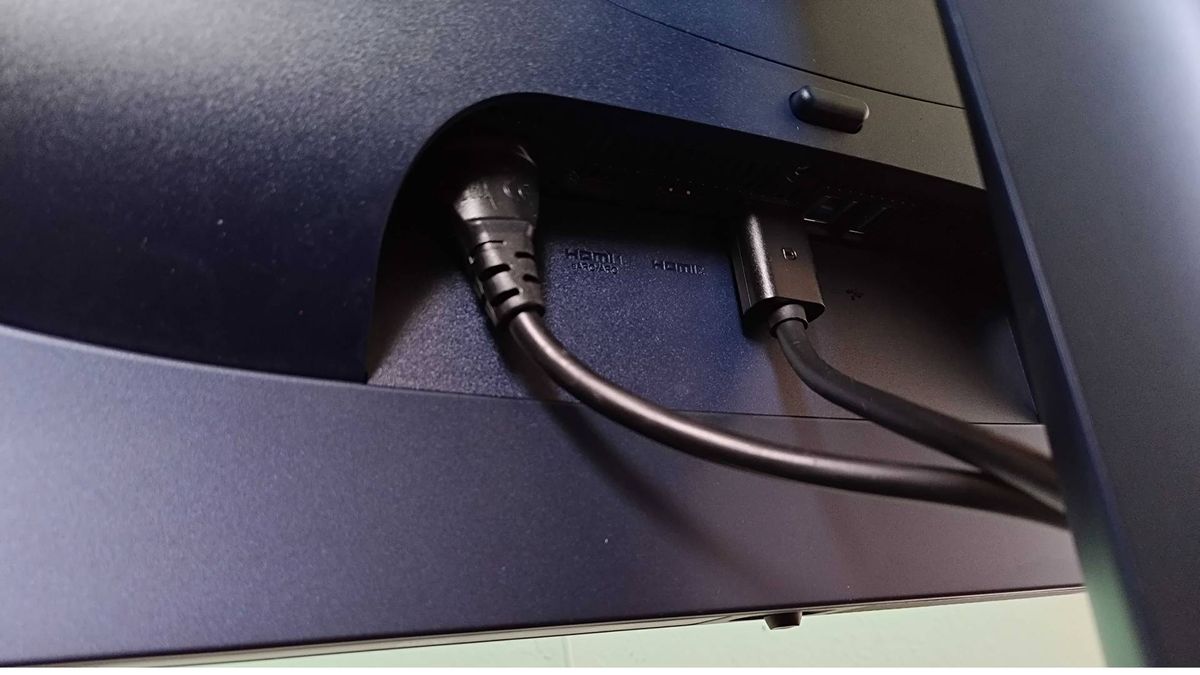 Close up of Alienware AW2725Q ports with cables attached.