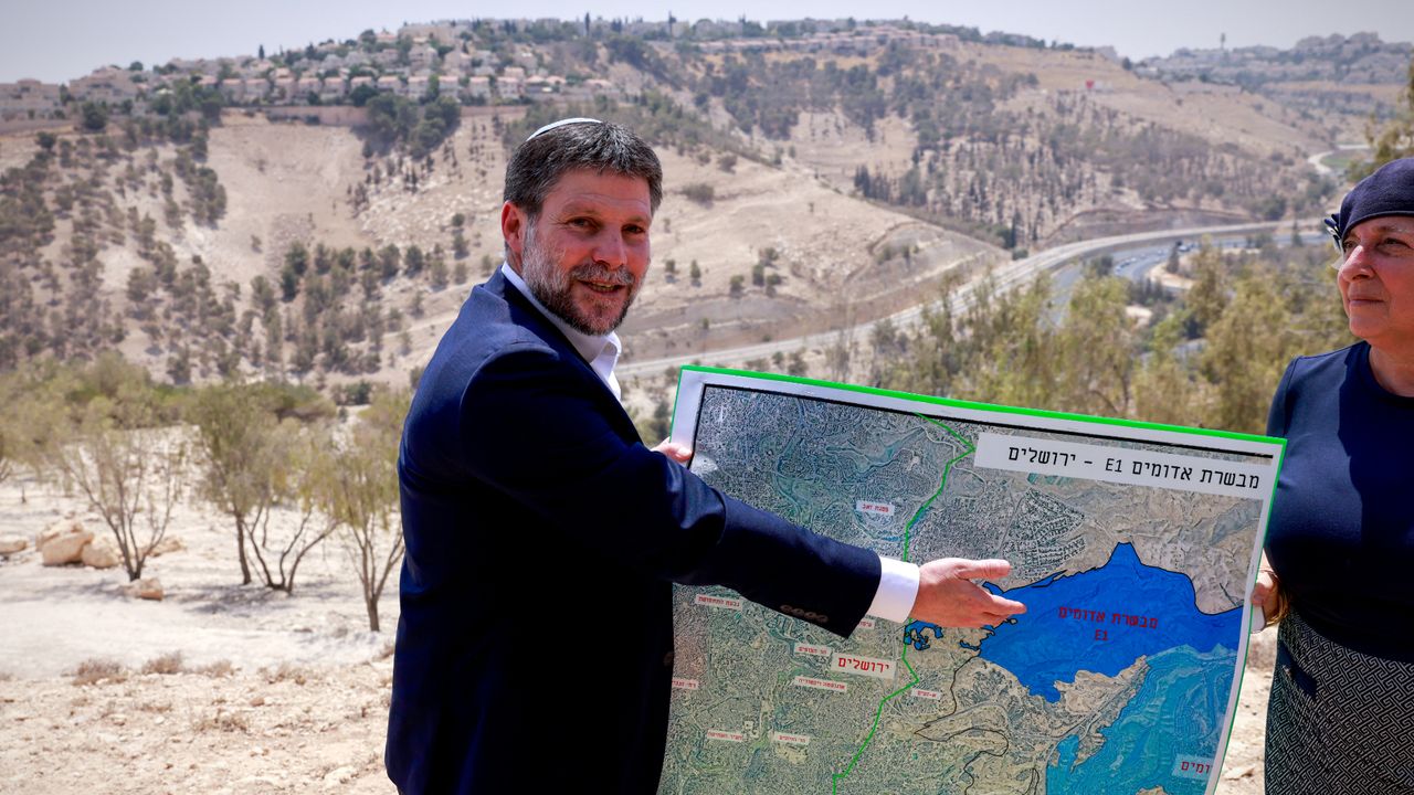 Israeli Finance Minister Bezalel Smotrich with map of Israeli West Bank settlements