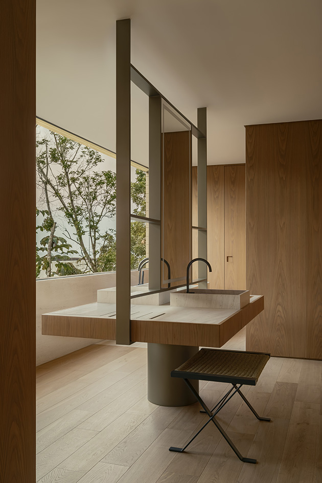 Bravissima House by Arthur Casas, a brazilian house nestled among the forest canopy and rising above the foliage to long views from large windows and ample terraces