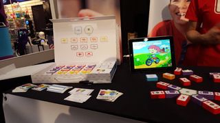MakerBloks teach kids about circuitry and electricity. An app-based game delivers challenges and puzzles that players must solve using the blocks.