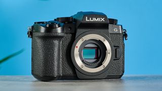 A black Panasonic Lumix G97 mirrorless camera