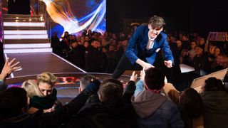 Cameron Cole shaking hands with audience members at Elstree Studios during the Big Brother 2018 final.